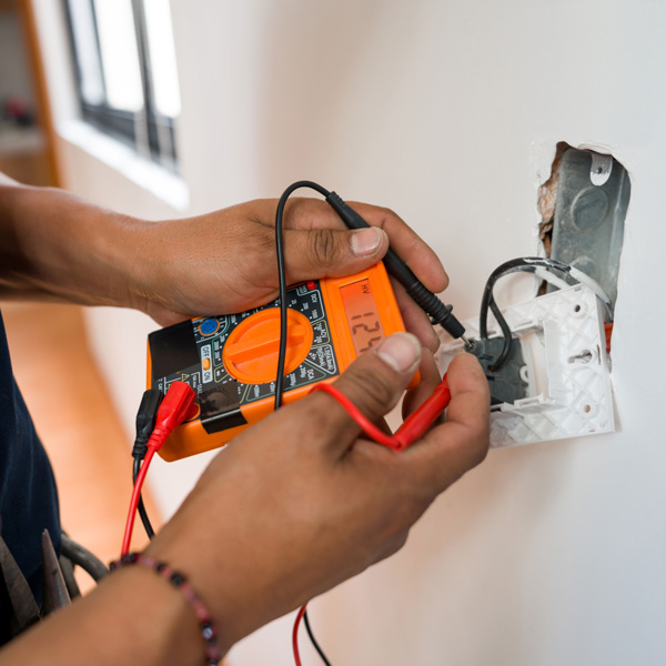 Man checking electric wires